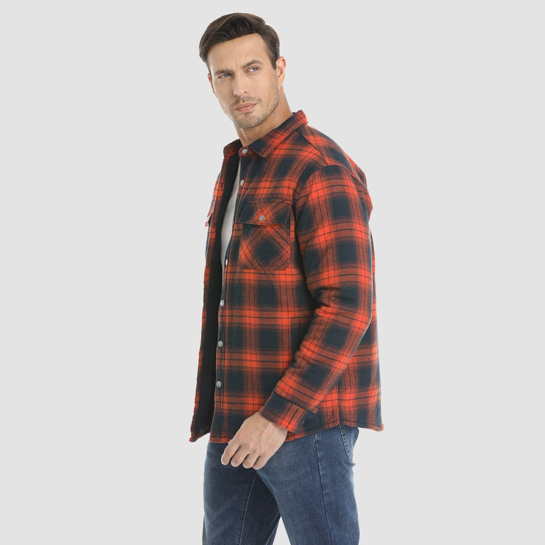 Side profile of a man wearing a quilted flannel jacket, showcasing its relaxed fit and winter wear
