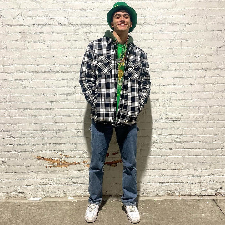 Men's quilted flannel jacket hanging on a wooden hanger, emphasizing its quality and design