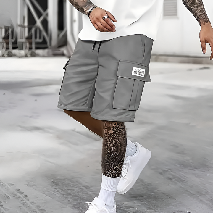 Men's relaxed fit cargo shorts with elastic waist, ideal for casual summer wear & comfortable travel.