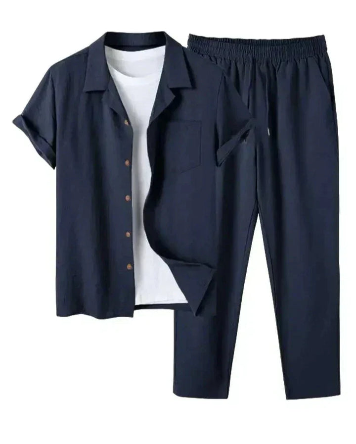 Man modeling a relaxed fit men's casual short sleeve shirt & matching pants set, great for summer loungewear.