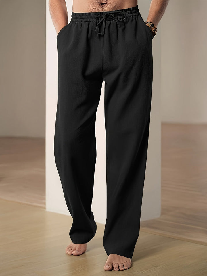 Comfortable men's drawstring loungewear pants with elastic waist and practical side pockets.
