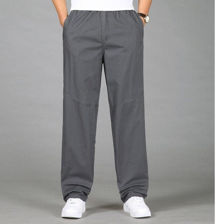 Light gray men's relaxed fit pull-on chino pants with elastic waist.