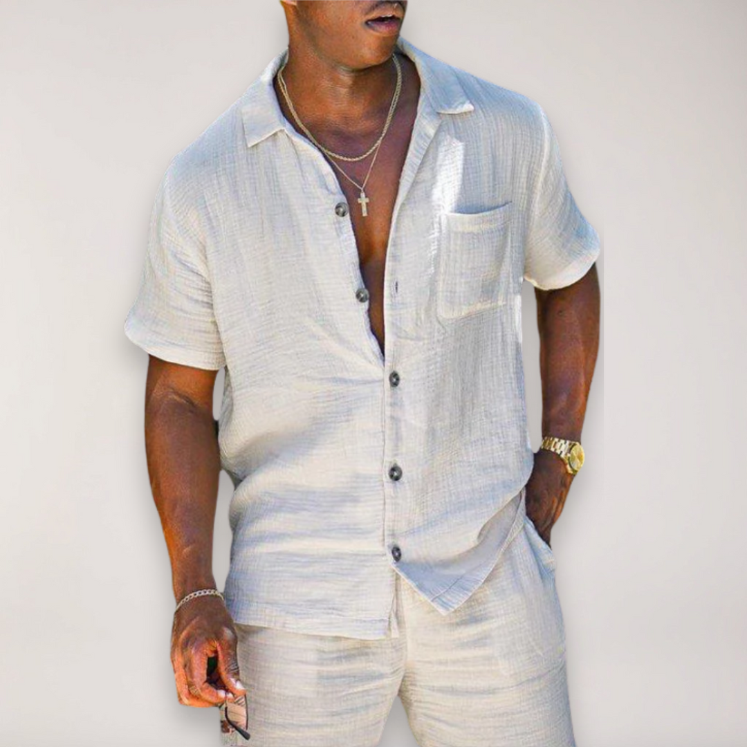 Men's relaxed fit summer two-piece short sleeve shirt & shorts set in a comfortable, coordinating design.