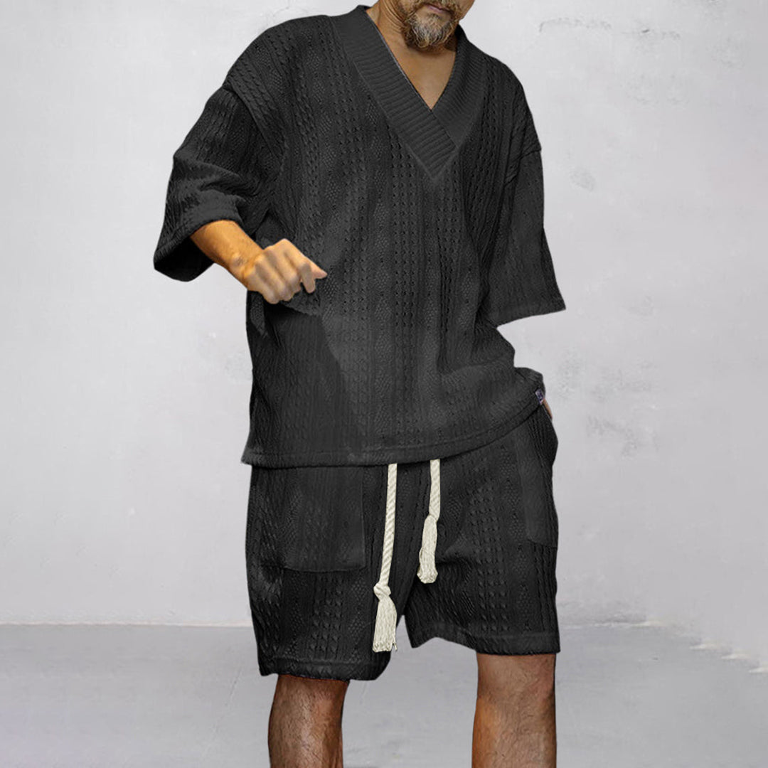 Back view of men's relaxed V-neck shirt & shorts lounge set. Comfort-focused summer casual wear.