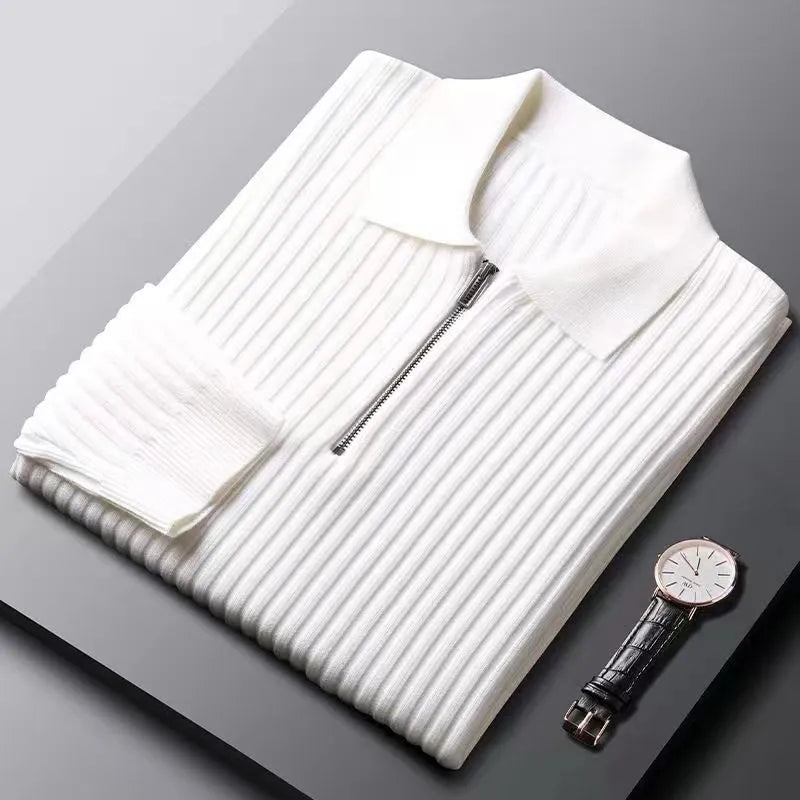 Casual mens apparel: a dark, long sleeve ribbed knit sweater with a practical zip neck.