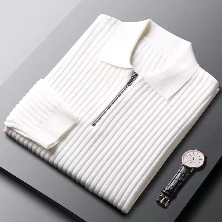Casual mens apparel: a dark, long sleeve ribbed knit sweater with a practical zip neck.