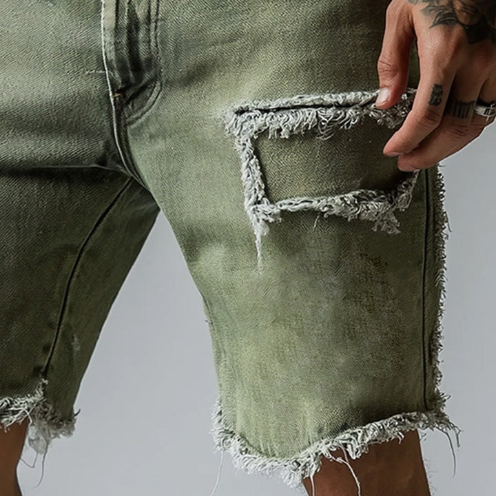 Men's stretch denim shorts with rips, five-pocket style, comfortable for casual distressed summer apparel.
