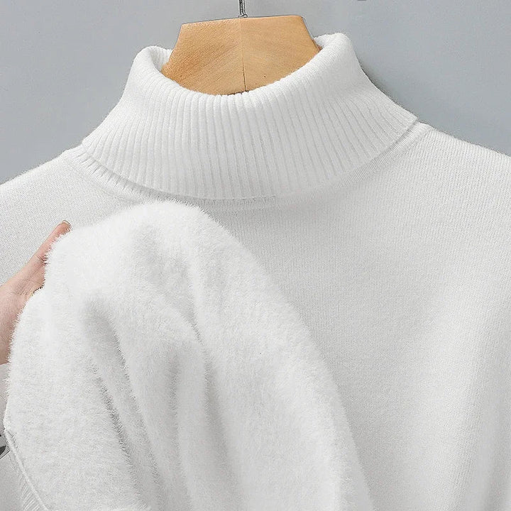 Soft, sleek men's long-sleeve turtleneck sweater, ideal for winter layering & elegant casual fashion.