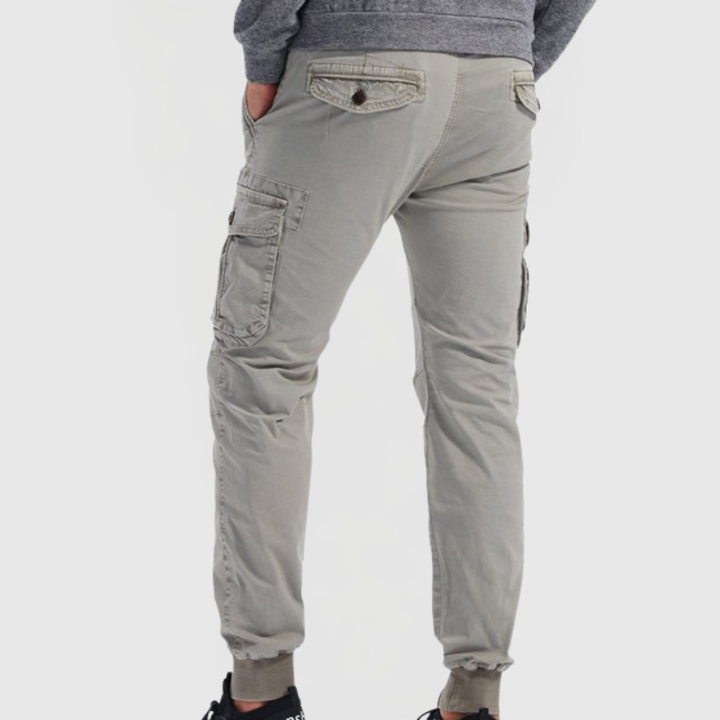 Versatile men's slim fit utility cargo joggers. Casual bottom with tapered leg, multiple pockets, and comfort drawstring.