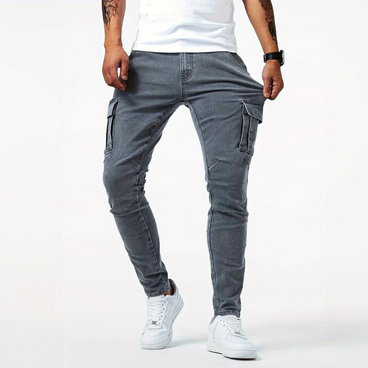 Close-up of men's slim fit cargo pants showcasing the detailed side flap pockets and fabric texture.