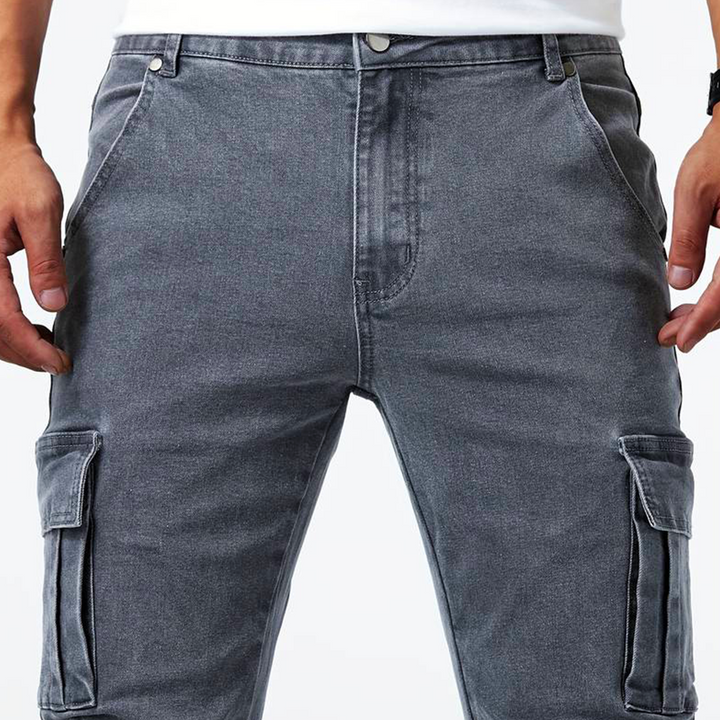 Modern men's slim fit cargo pants with multiple side flap pockets, perfect for a sleek casual style.