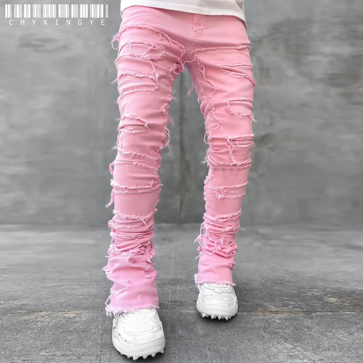 Casual men's slim fit ripped jeans featuring distressed denim & fashionable tears. Ideal for everyday urban street style.