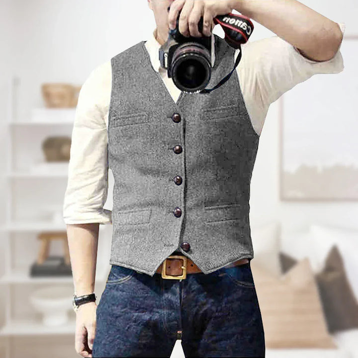 Stylish men's slim fit tweed vest for weddings, business attire, or as a layering piece. Classic herringbone pattern.