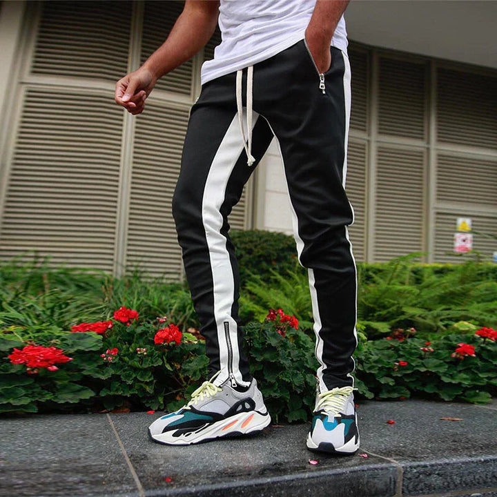 Comfortable men's slim fit joggers for casual wear or workouts, with modern zip hem detail & athletic style.