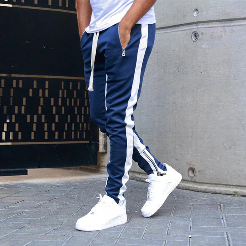 Versatile men's sportswear: slim fit track sweatpants with practical zip hem, perfect for an active lifestyle.