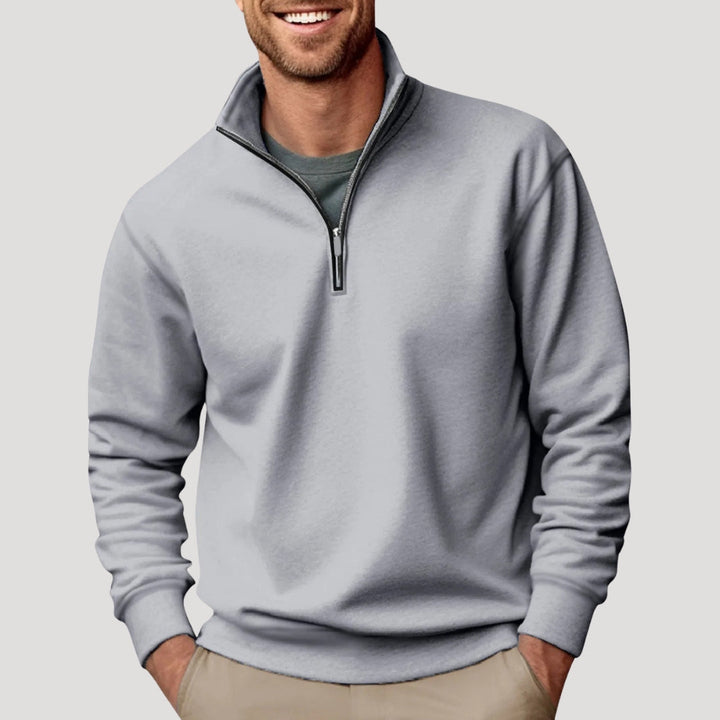 Men's fall fashion quarter-zip pullover. Smart casual long-sleeve sweater with collar for modern menswear style.