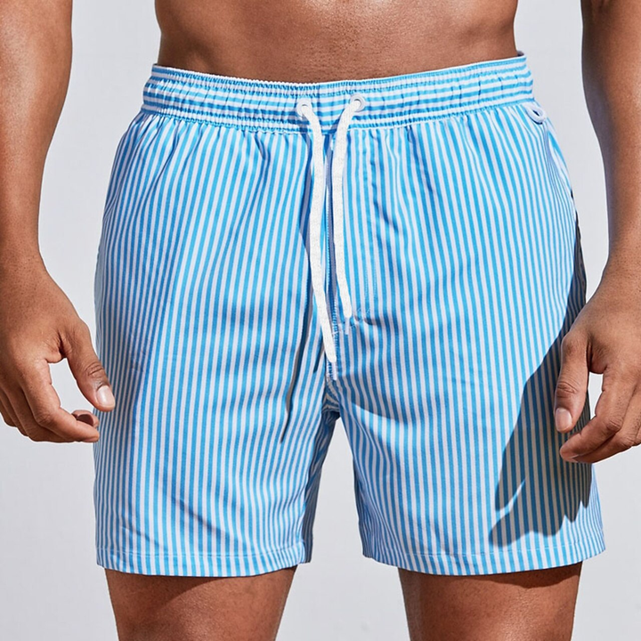 Stylish striped men's swim trunks, ideal for summer vacation & casual poolside wear.
