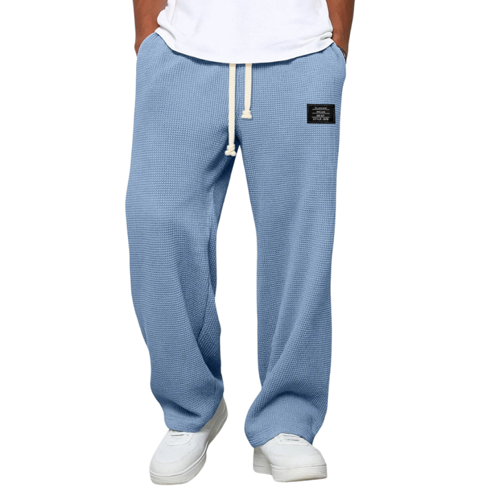 Men's Stuart loose fit drawstring chino pants, comfortable for everyday wear. Relaxed wide leg style.