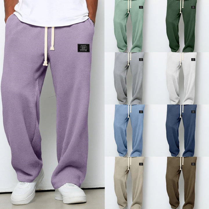 Fabric texture of Stuart men's comfortable loose fit chino pants. Drawstring closure for casual wear.