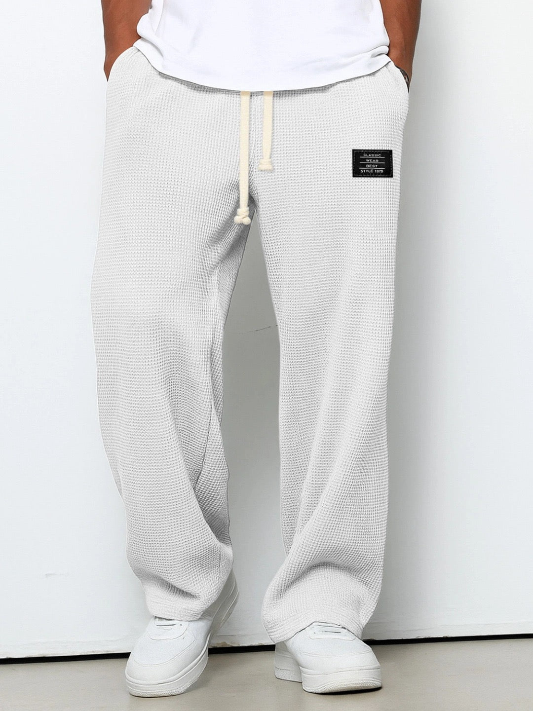 Side view of Men's Stuart wide leg chino pants, offering a relaxed fit & comfort for casual wear.