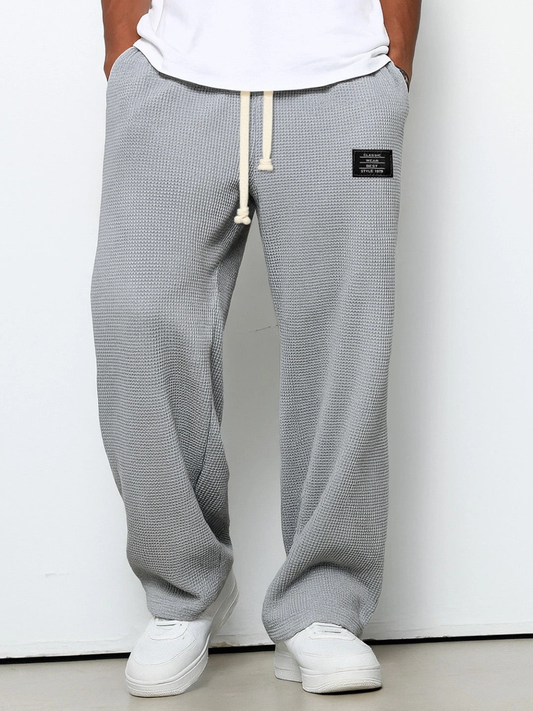 Back view of Stuart men's loose fit drawstring chino pants with practical pockets, ideal for everyday.
