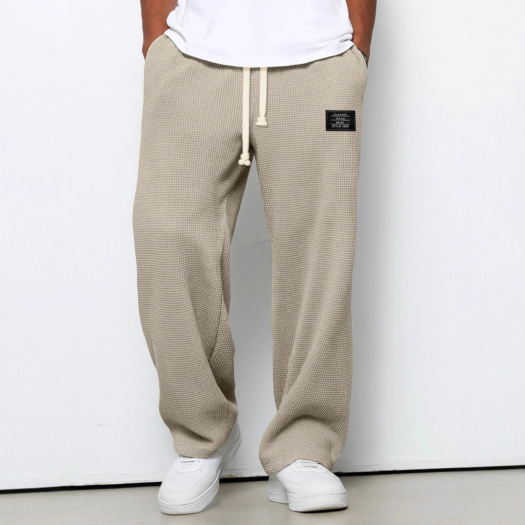 Detail of the waffle knit texture on Men's Stuart comfortable, relaxed fit chino pants. Wide leg style.