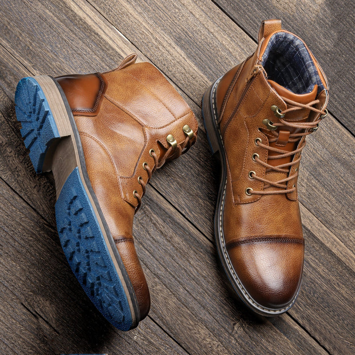 Stylish men's leather cap toe ankle boots, lace-up closure for a sophisticated look.