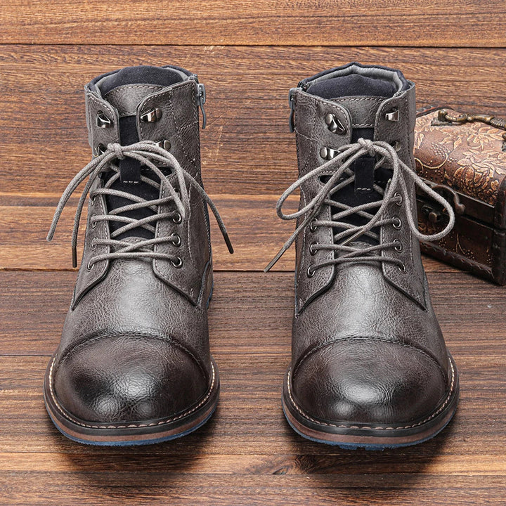 Men's fashionable lace-up cap toe ankle boots, offering a blend of style and comfort.
