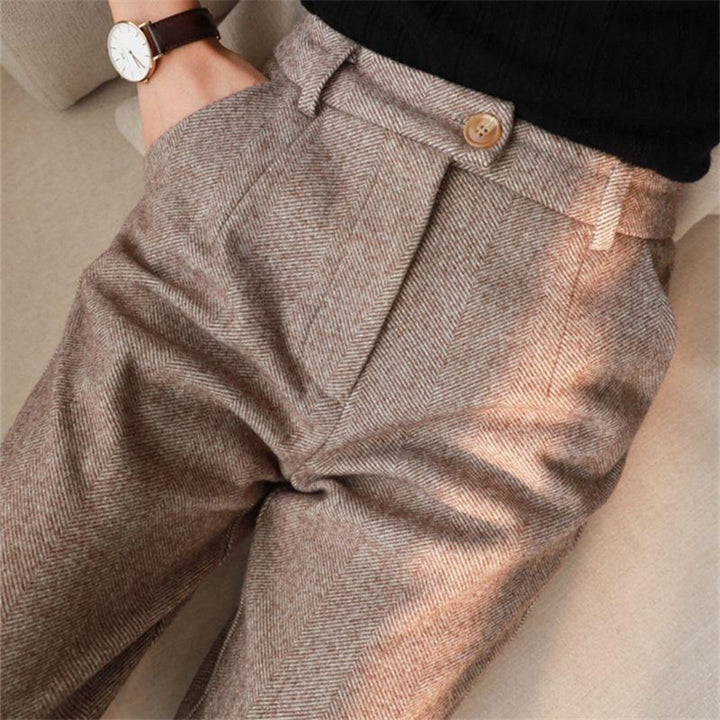 Men's smart-casual ankle pants, folded neatly to show the hem detail and lightweight material