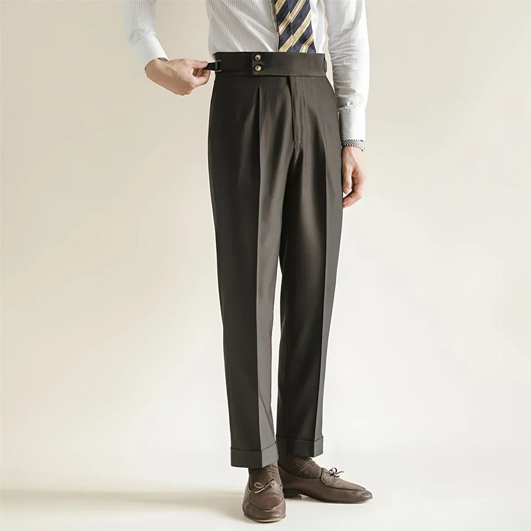 Close-up of the fabric on men's tailored dark blue business trousers, showing cotton blend texture.