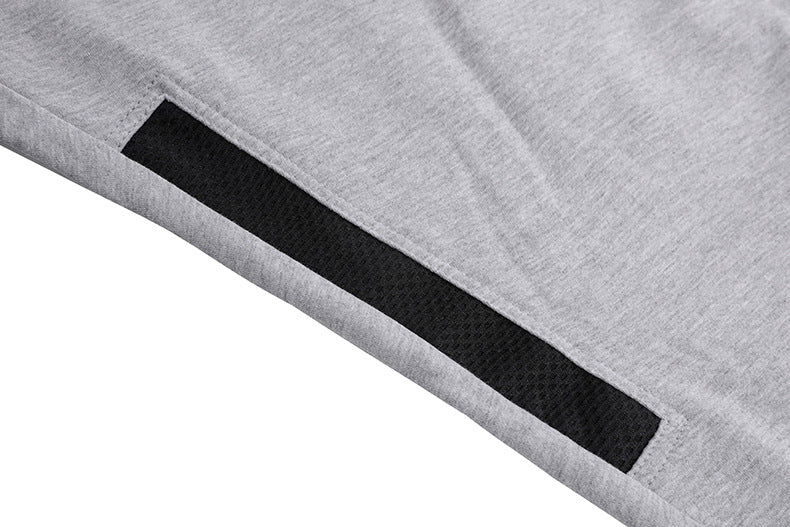 Group of men's tapered athletic joggers stacked, highlighting color variety