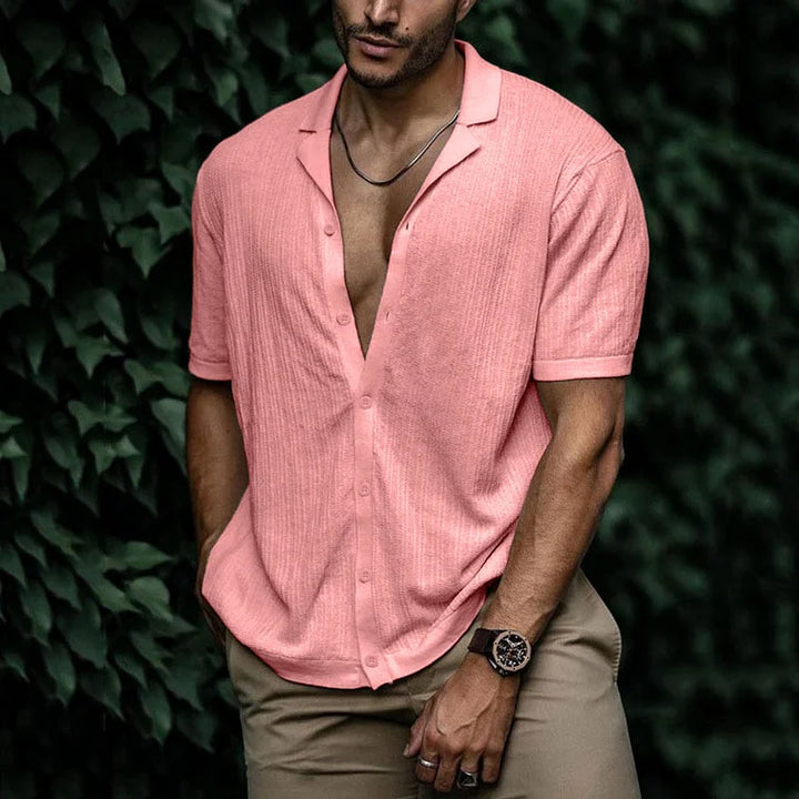 Detail shot: Stylish Cuban collar on a men's textured short sleeve summer shirt. Button-down, relaxed fit.