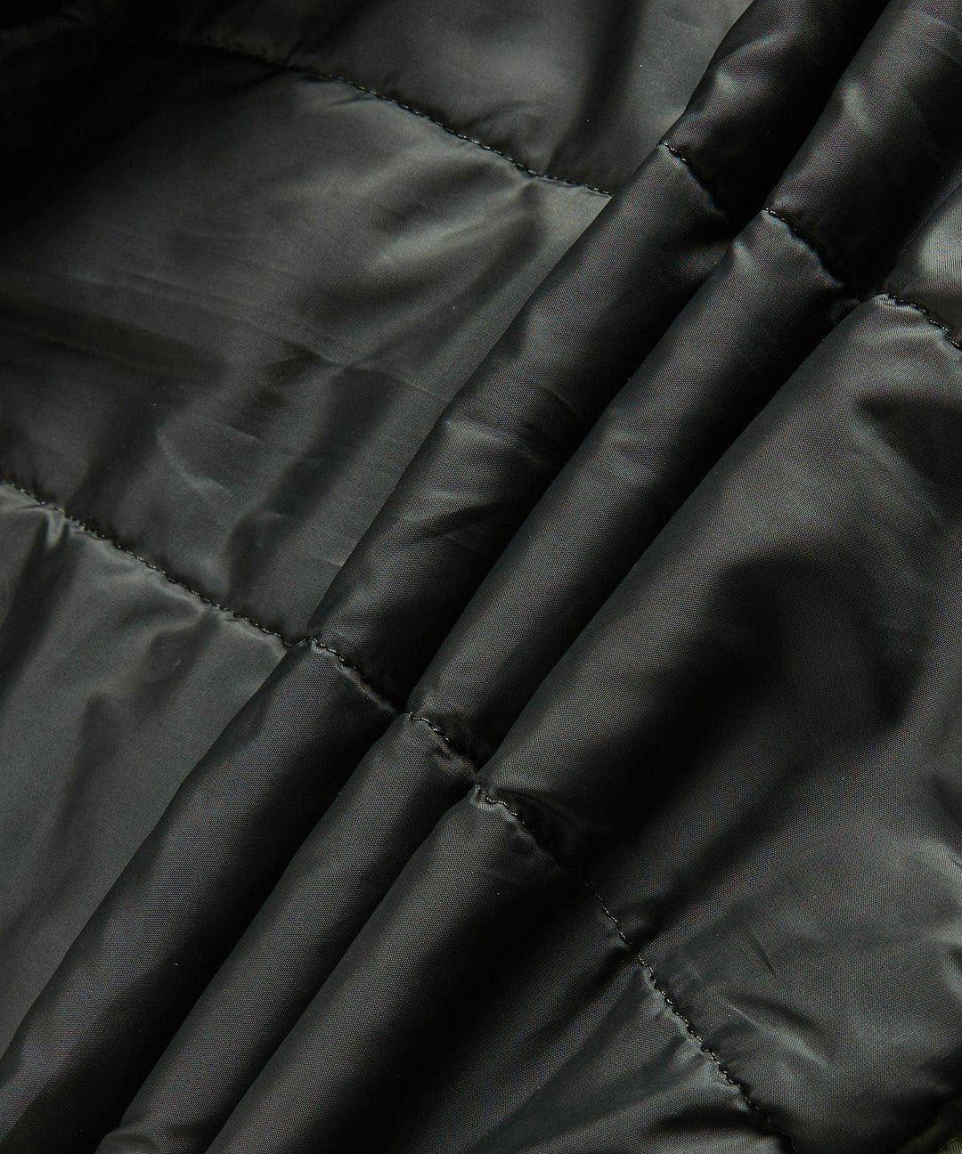 The men's insulated military jacket in motion, demonstrating its flexibility and urban fashion appeal.