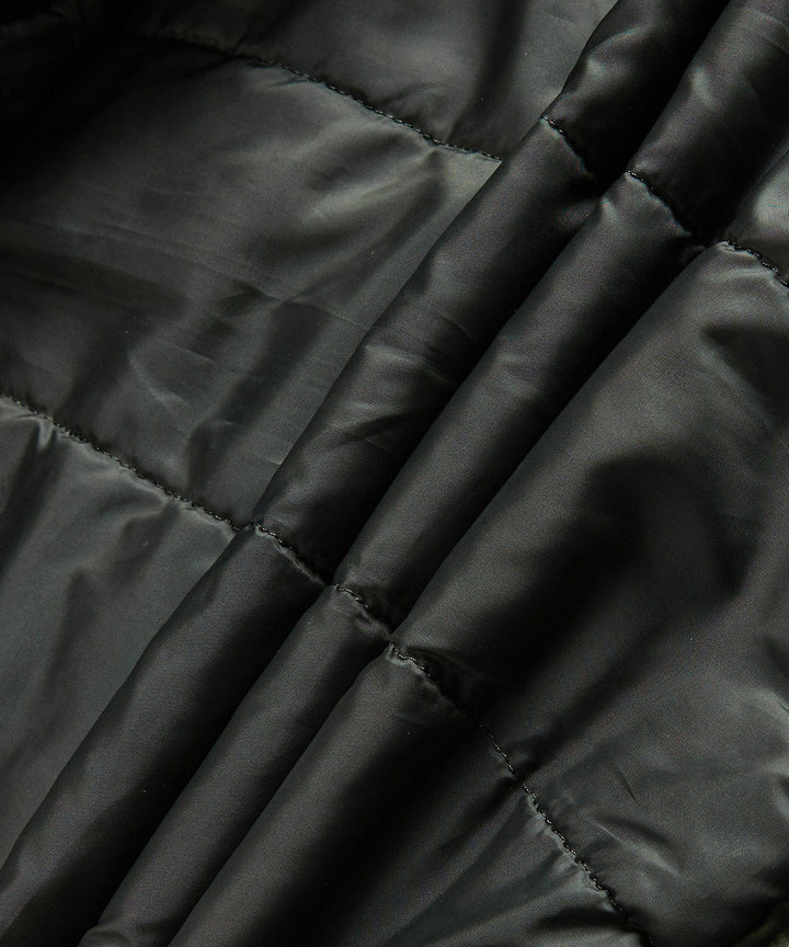 The men's insulated military jacket in motion, demonstrating its flexibility and urban fashion appeal.