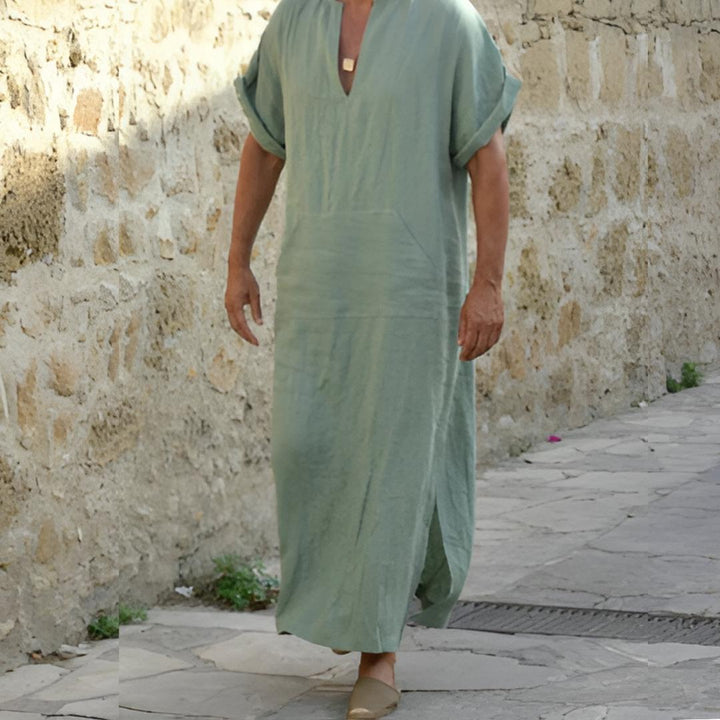 Casual men's V-neck long shirt with unique side slits, perfect for a relaxed fit and modern look.