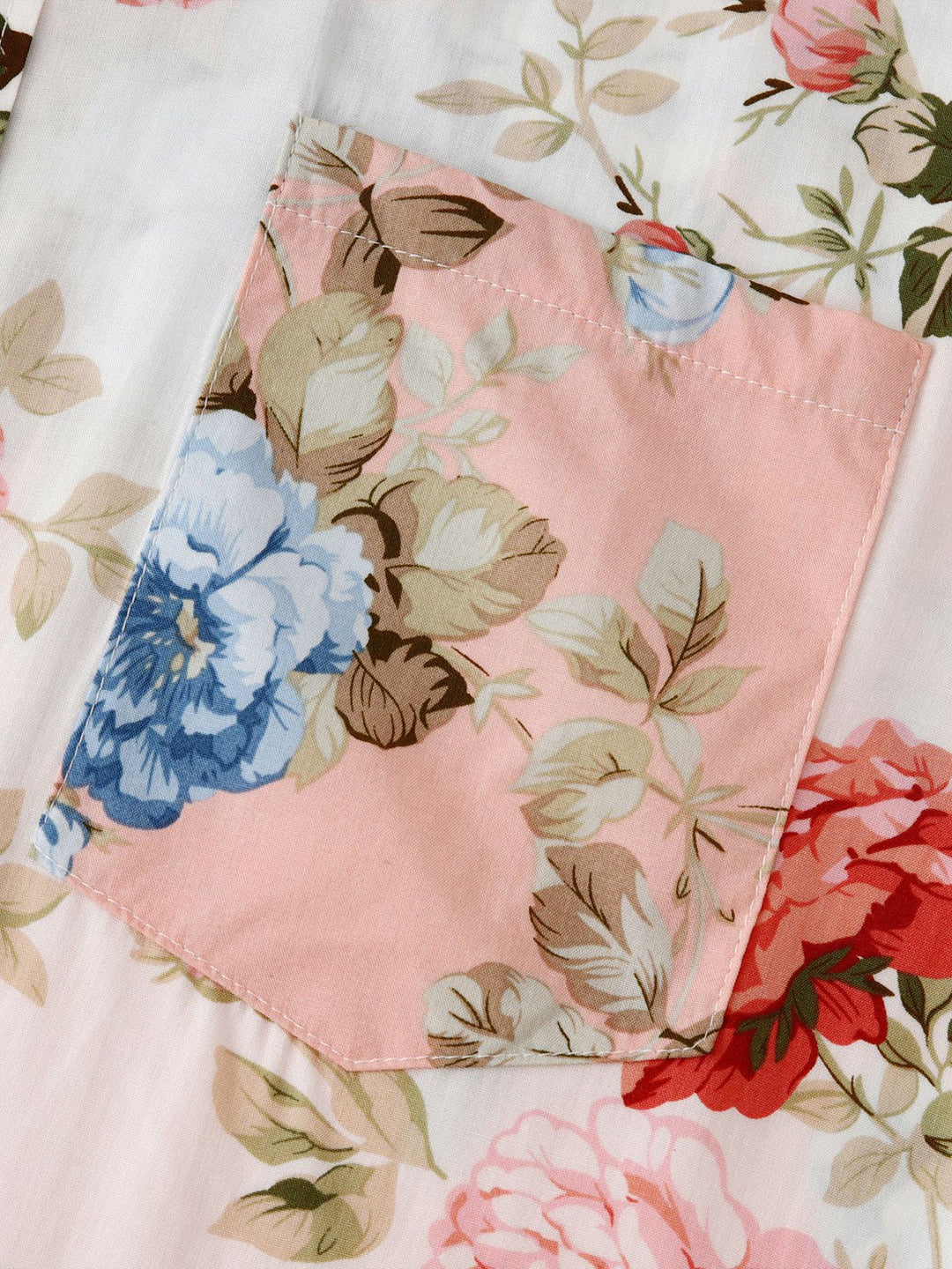 Flat lay of a stylish men's floral short sleeve button-down shirt, ready for summer.