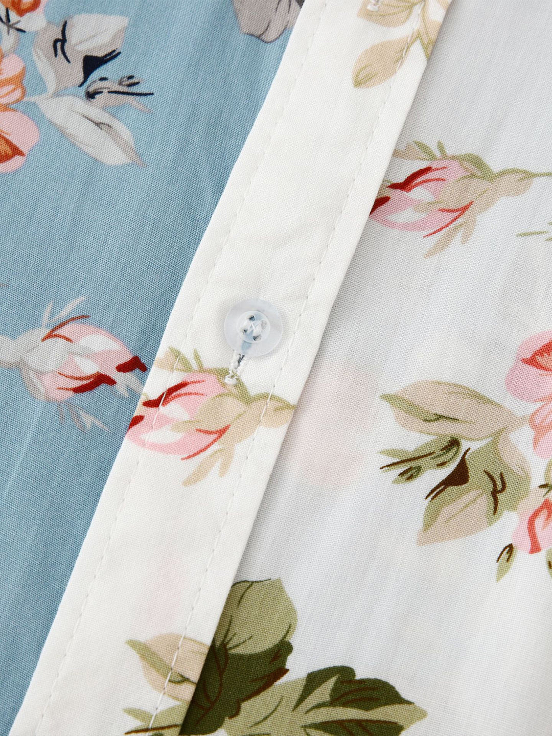 Detailed floral print on a men's short sleeve button-down summer shirt, unique apparel.