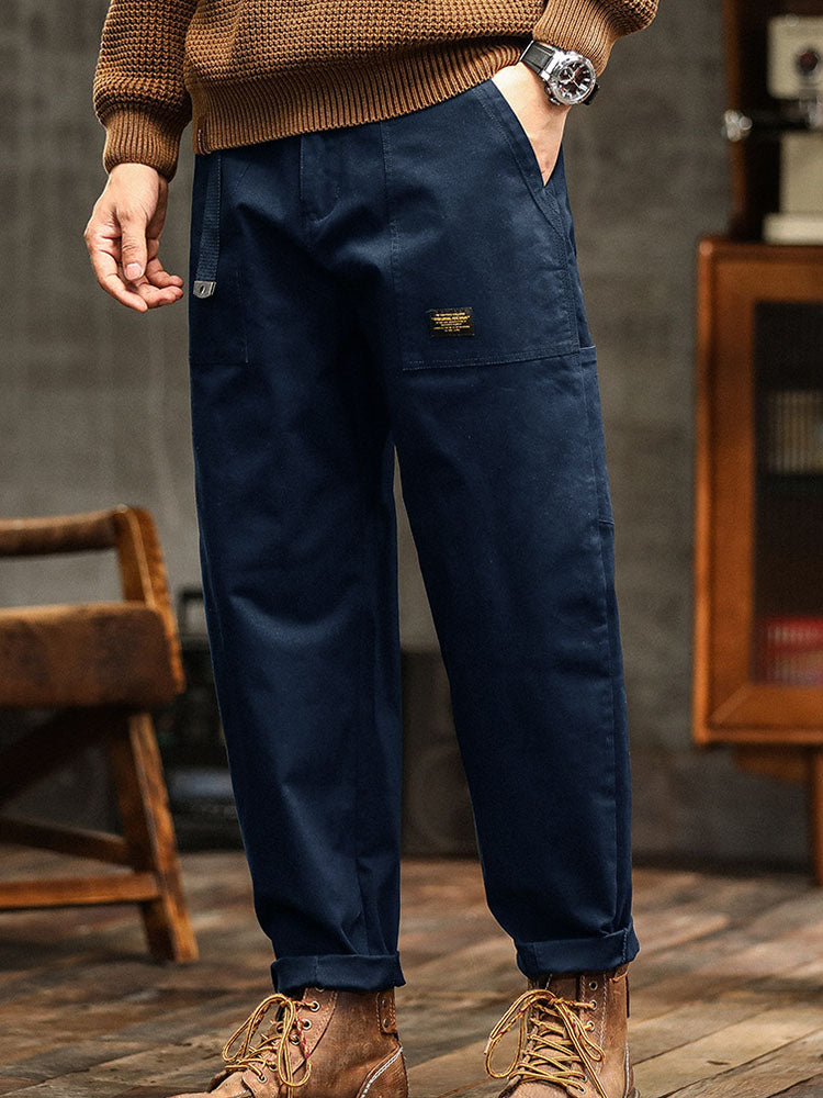 Army green men's casual utility pants. Vintage workwear inspired, relaxed fit for any adventure.