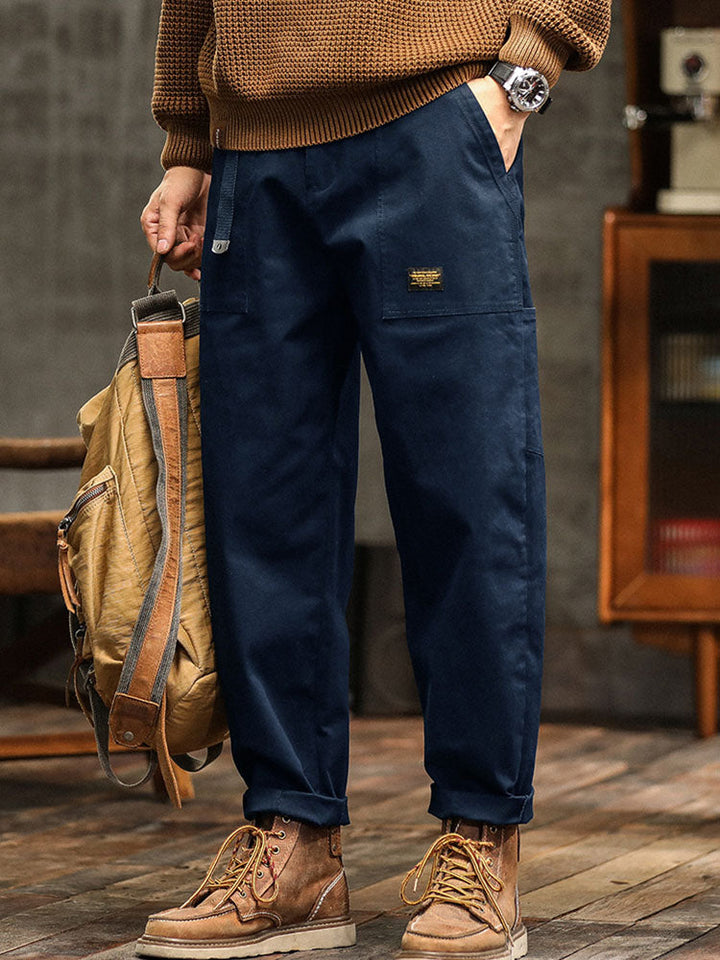 Navy blue men's vintage utility pants. Relaxed fit, ideal for casual fashion & comfortable wear.