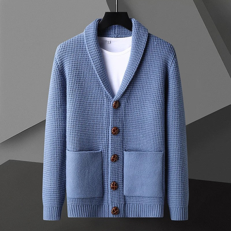 Close-up of a men's waffle knit cardigan, highlighting the texture and shawl collar detail.