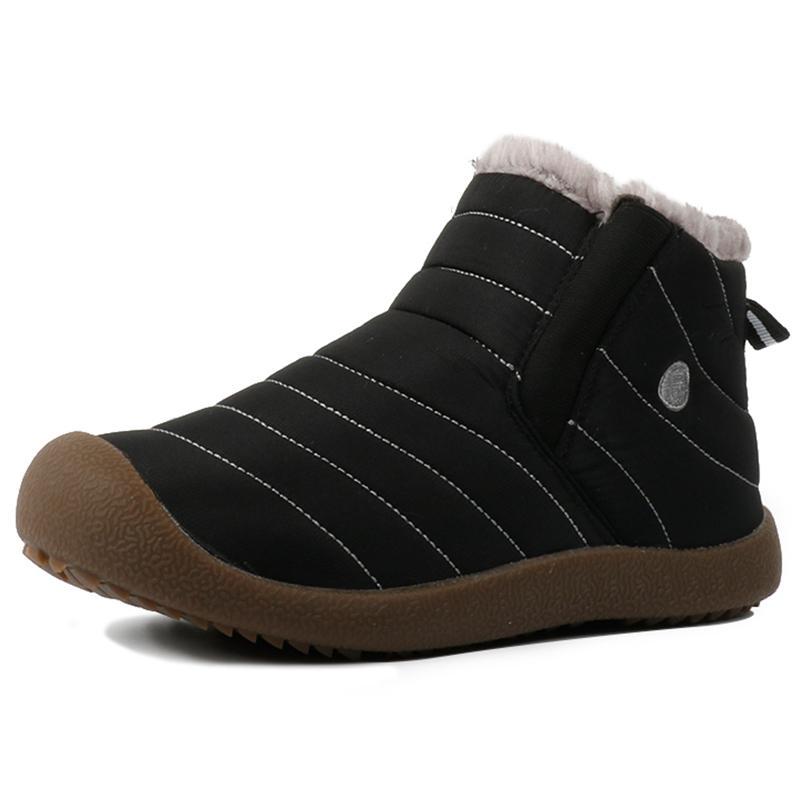 Close up of waterproof material on men's black hiking and snow boots