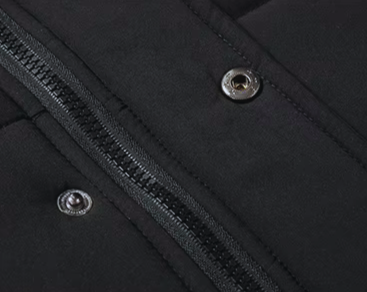 Men's seasonal fashion shot, featuring a warm, fur-lined heavy-duty jacket in an urban setting.
