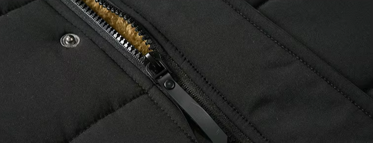 Close-up of the material and stitching on a durable men's winter jacket, signifying quality outerwear.