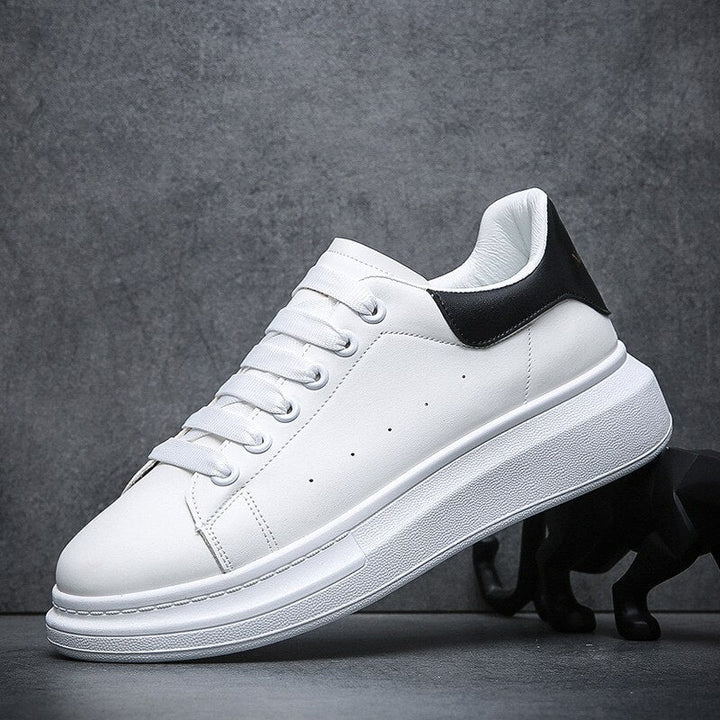 Modern men's platform casual shoes. White lace-up sneakers with a trendy chunky sole, perfect for streetwear.