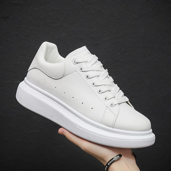 Versatile men's white platform sneakers. Comfortable lace-up design for everyday fashion and casual outfits.