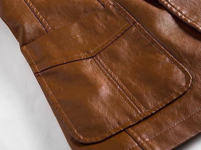 Two-button closure detail on a men's elegant tailored blazer jacket, highlighting quality.
