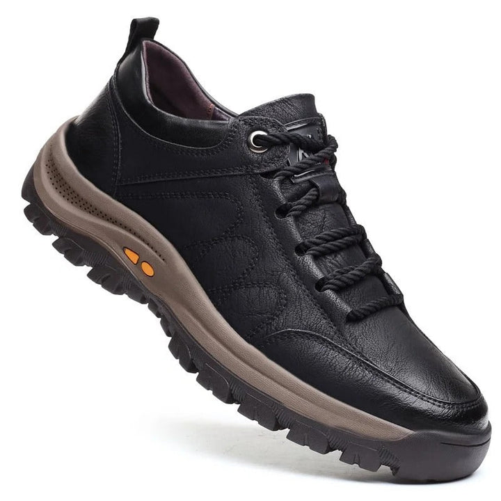 Men's black orthopedic shoe with waterproof features and ergonomic design.