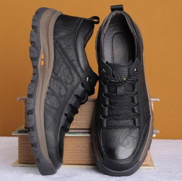 Detail shot of the interior comfort of men's black orthopedic shoes.