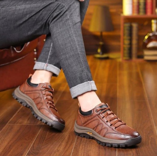 Lifestyle image of a man wearing black orthopedic shoes for everyday comfort.
