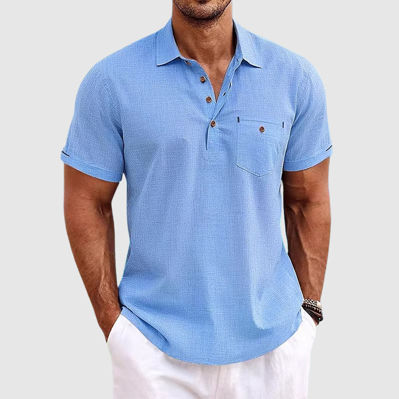 "Men's textured polo shirt with chest pocket, short sleeves, turn-down collar, and relaxed fit for warm-weather comfort."